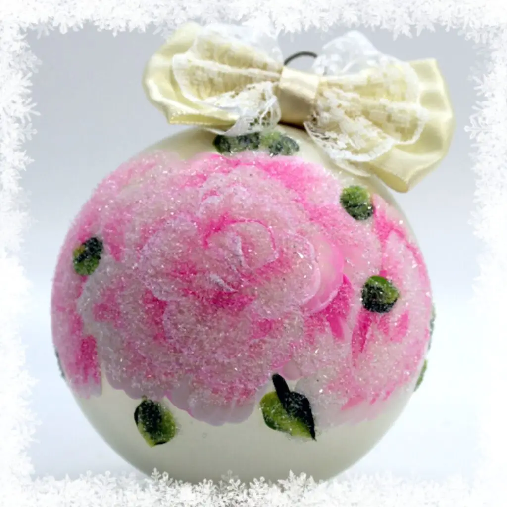 Pink hand-painted rose ornament with glittering German glass and cream lace bow