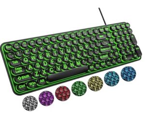 Large print black keyboard with softly glowing backlit keys, showing oversized white letters for easy visibility.